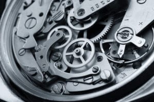 Understanding financial bias Clifton Nash blog post - Image of cogs in a machine